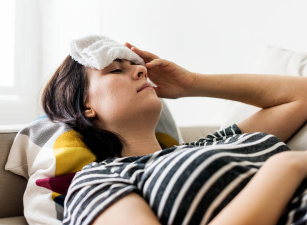 istock Woman with a cold and high fever 1030883376