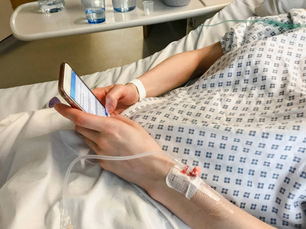 istock Patient Messaging In Hospital Bed 1030886490