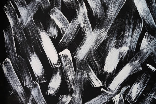 istock abstract wallpaper painted by white brush on black background texture. 1030887178