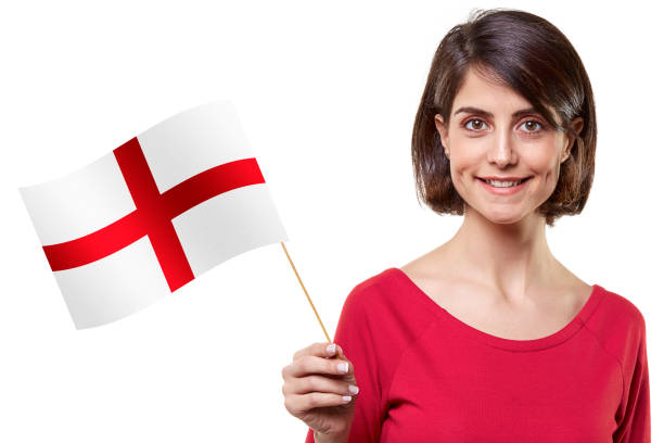 Young woman holding an England flag on white background