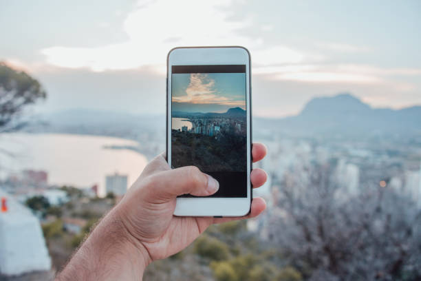 Taking a picture of the sunset over Benidorm, Spain, with a smartphone