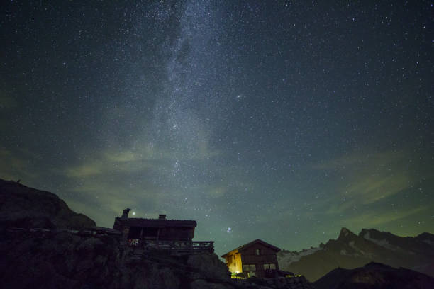 istock Milky Way and Starry Summer Sky over Mountain Shelters 1030901484