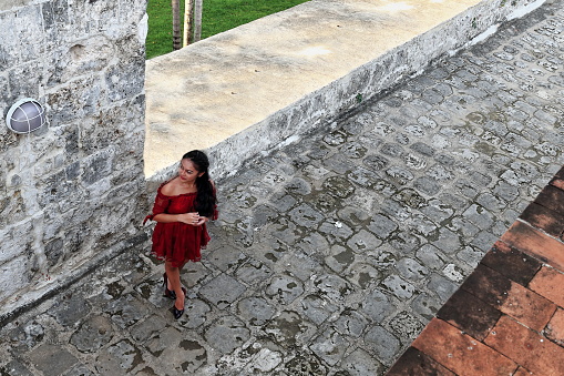 Cebu City, Philippines-October 18, 2016: Filipino model dressed in contemporary attire poses for photoshoot in the triangular shaped Fuerte-Fort-Fuerza de San Pedro. Today's structure dated 1738 AD.