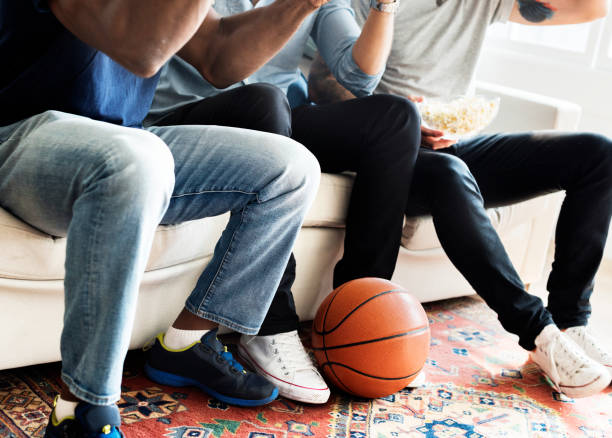 istock Friends cheering sport league together 1030904084