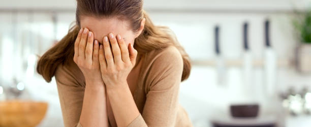 istock Stressed young woman in kitchen 1030907522