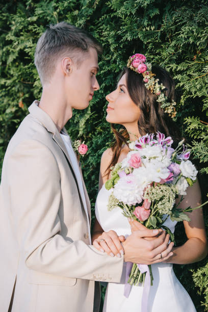 istock traditional wedding couple looking at each other 1030908544