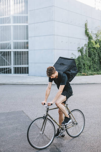 istock Bike messenger sitting on his bicycle. 1030912602