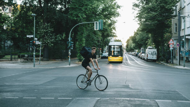 istock Bike courier riding down the street. 1030912762