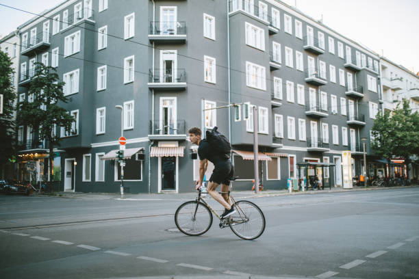 A young African American man explores China Town in New York City with his fixed gear bicycle.