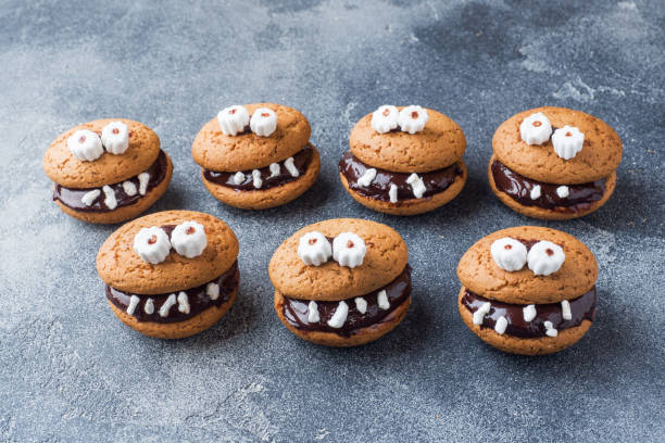istock Cookies with chocolate paste in the form of monsters for Halloween 1030912988