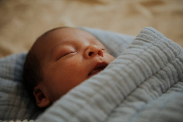istock Infant baby fast asleep on the bed 1030913954
