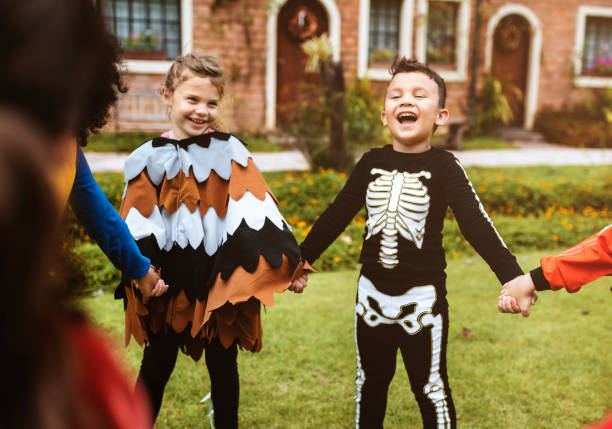 istock Little kids at a Halloween party 1030921730