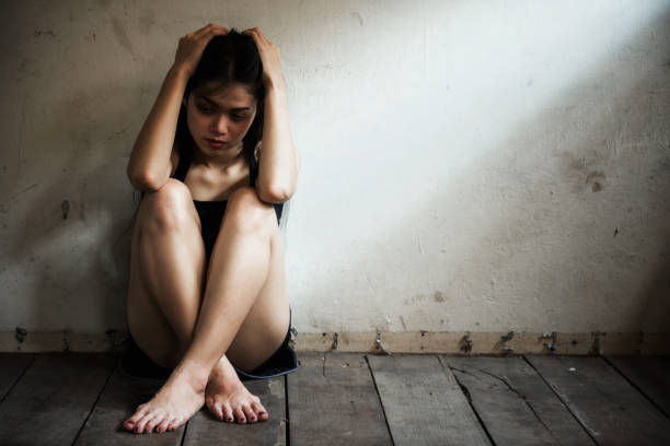 istock Depressed Woman in dirty room 1030921748