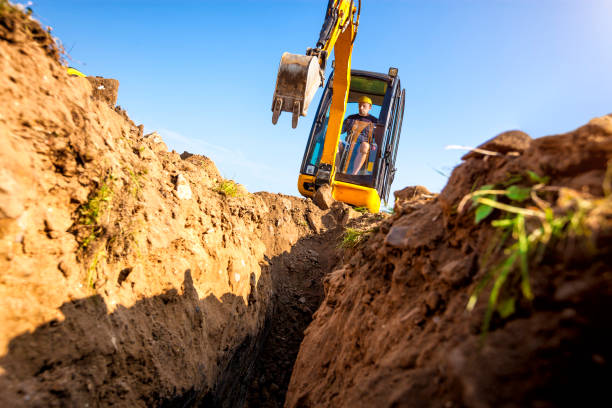istock Excavator digs the foundation for the house 1030922374
