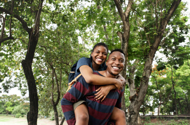 istock Man giving his girlfriend a piggyback ride 1030925262