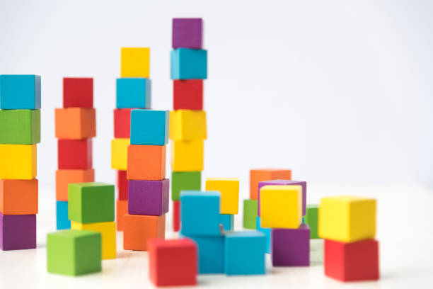 istock Close-Up Of Multi Colored Toy Blocks Over White Background 1030930070