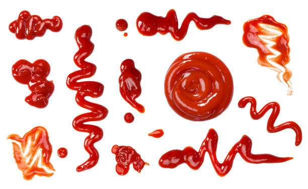 Ketchup splashes, group of objects Ketchup splashes, group of objects. Arrangement of red ketchup or tomato sauce, isolated white background, top view. savory sauce stock pictures, royalty-free photos & images