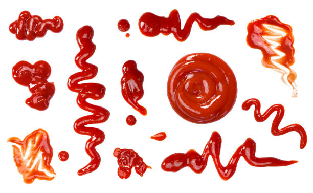 Ketchup splashes, group of objects Ketchup splashes, group of objects. Arrangement of red ketchup or tomato sauce, isolated white background, top view. tomato sauce stock pictures, royalty-free photos & images