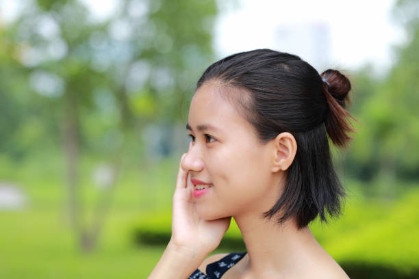 istock the face of woman in green background 1030930708