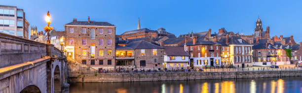 York cityscape panorama Panorama York cityscape along river ouse sunset dusk, York Yorkshire England UK. ouse river photos stock pictures, royalty-free photos & images