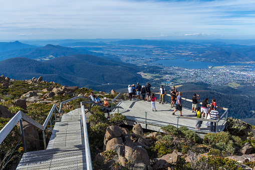 Mount Wellington, Hobart, Australia - January 7 2017: Tourists on viewing platform with Panorama of Hobart