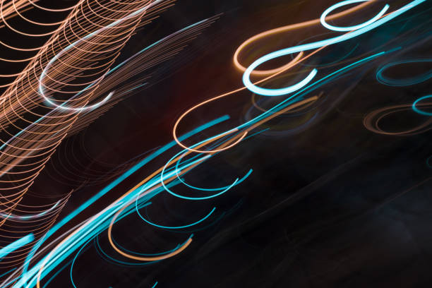 istock Abstract light lines on black background. Light trails against dark background. 1030939616