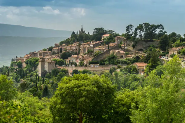 Bonnieux is a small mountain village in the mountain range of the Luberon in the Provence. It is sunny, but a thunderstorm is approaching.