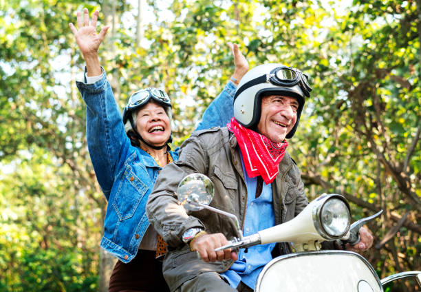 istock Senior couple riding a classic scooter 1030945208