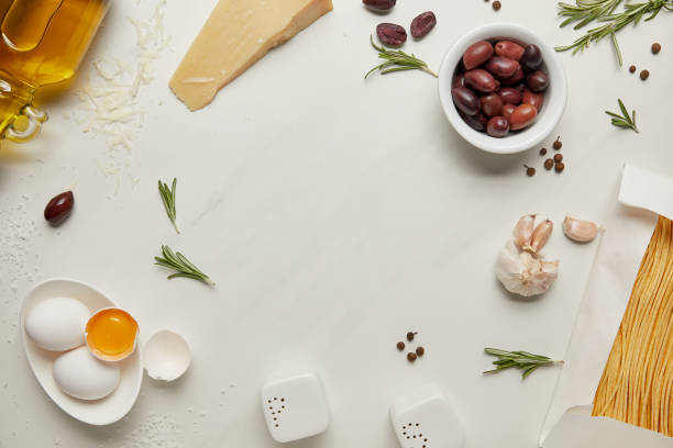 istock flat lat with assorted italian pasta ingredients arranged on white marble surface 1030945280