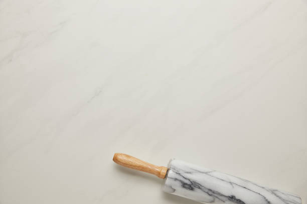 istock top view of rolling pin on white marble surface 1030945312