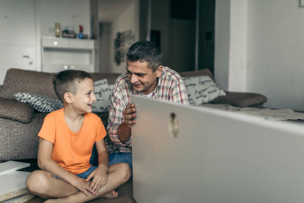 istock Single father is assembling furniture with his kids 1030945322