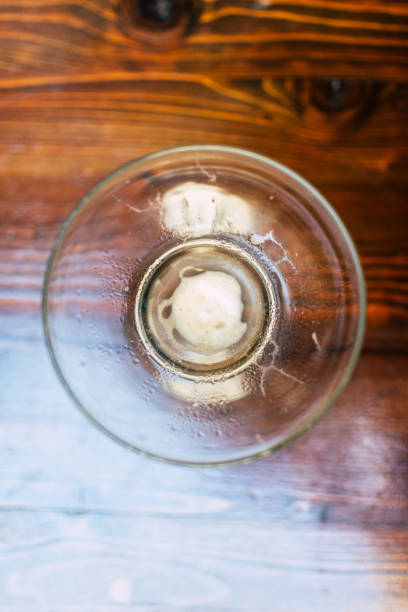 Empty Glass Over Wooden Table from Above