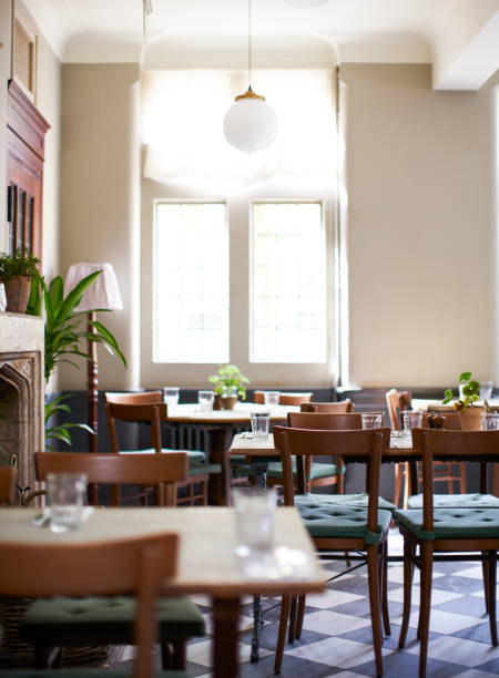 istock Tables Laid For Service In Empty Restaurant 1030953158