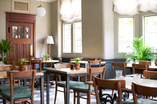 istock Tables Laid For Service In Empty Restaurant 1030953160
