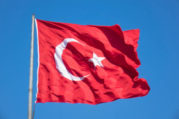 istock Turkish flag waving in blue sky, Ankara, TURKEY 1030958070