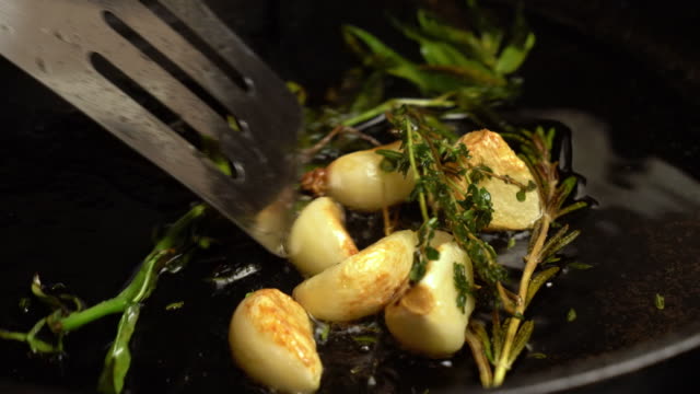 Sizzling Garlic, Rosemary and Tarragon roasting in Olive Oil