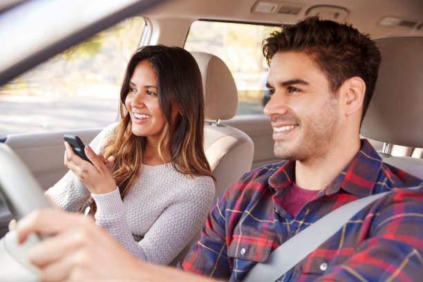 istock Woman passenger using GPS on smartphone during car journey 1030960746