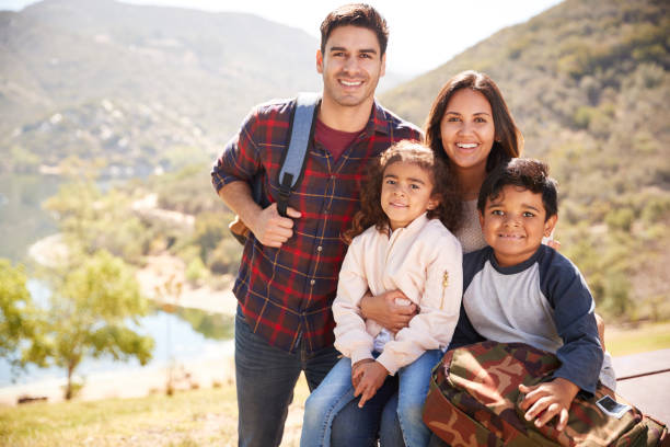 Parents and children taking a break during a mountain hike