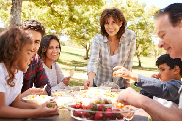 istock Happy multi generation family having a picnic in a park 1030969920