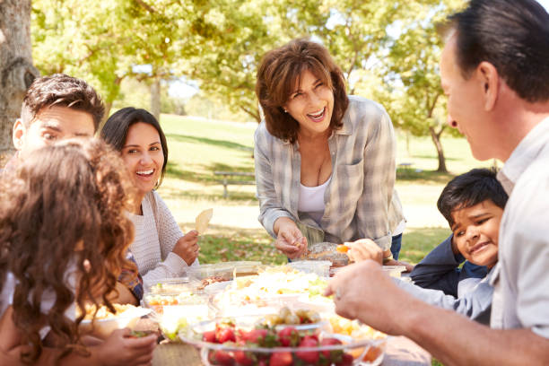 istock Happy multi generation family having a picnic in a park 1030970006
