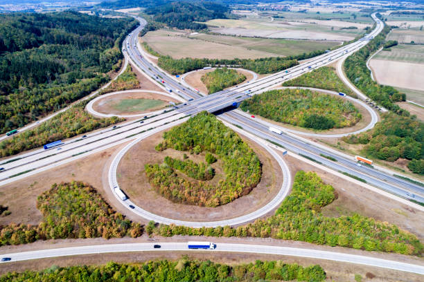 istock Aerial view of clover leaf highway intersection with heavy cargo traffic 1030970140