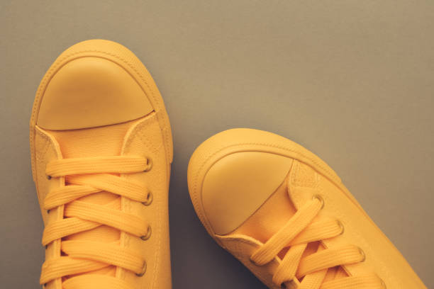 istock Stylish yellow sneakers from above 1030977974