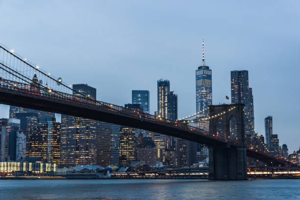 istock Lower Manhattan skyline and Brooklyn Bridge at Dusk 1030982206