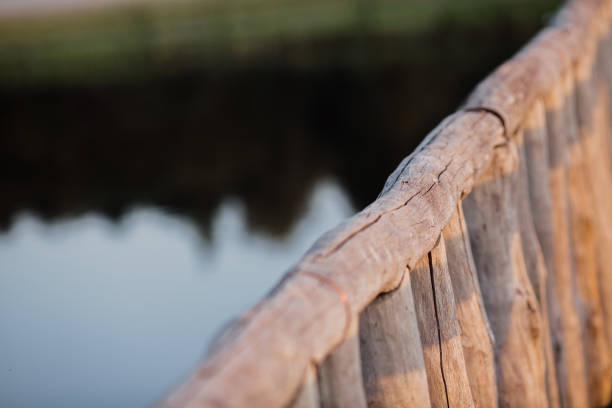 wooden handrail of a log bridge