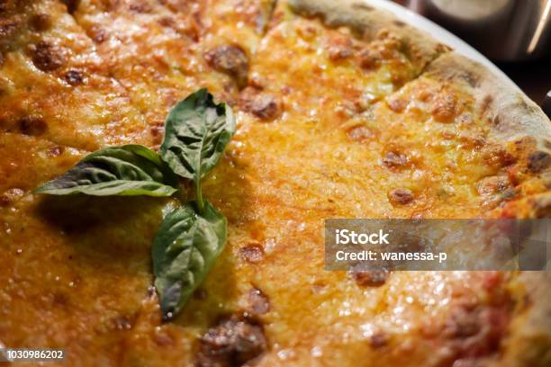 Delicious Cheesy And Freshly Baked Pizza Margherita The Archetype Of Neapolitan Pizza And The Italian Unification Decorated With Basil Stock Photo - Download Image Now