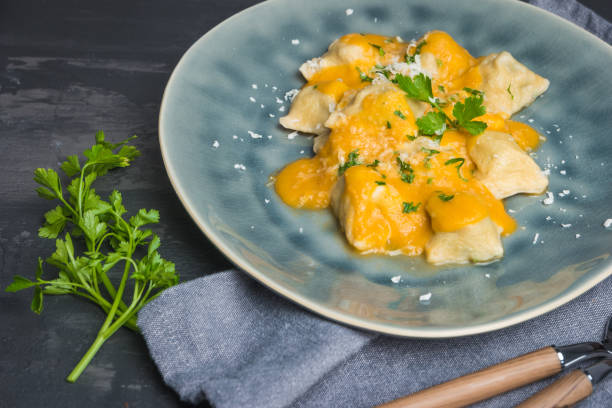 istock Homemade ravioli cooked served with tomato sauce. 1030986418