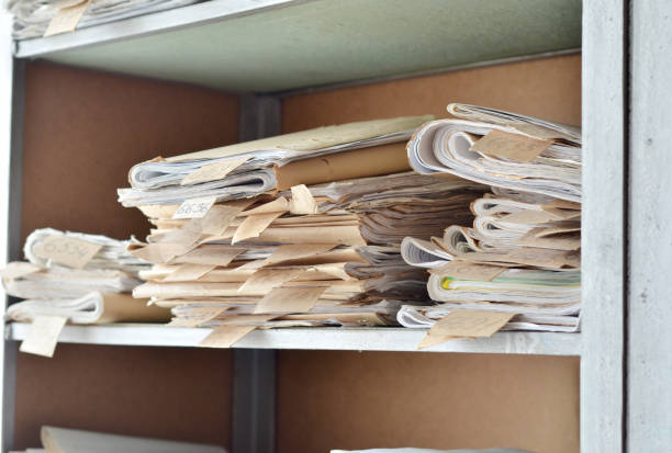 istock Old documents, drawings with numbers stacked on shelves in the office 1030992496