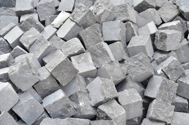 istock Granite chipped gray paving slab. Dropped into a bunch 1030992604