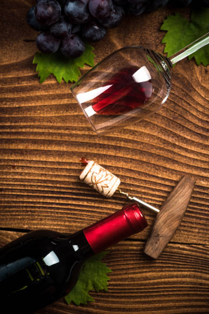 istock Bottle of red wine with corkscrew 1030995490