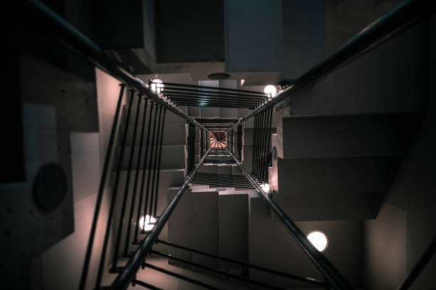 istock Modern staircase bottom-up view in a low light 1030999338
